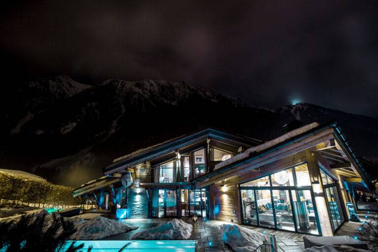 chalet couttet pool at night in winter